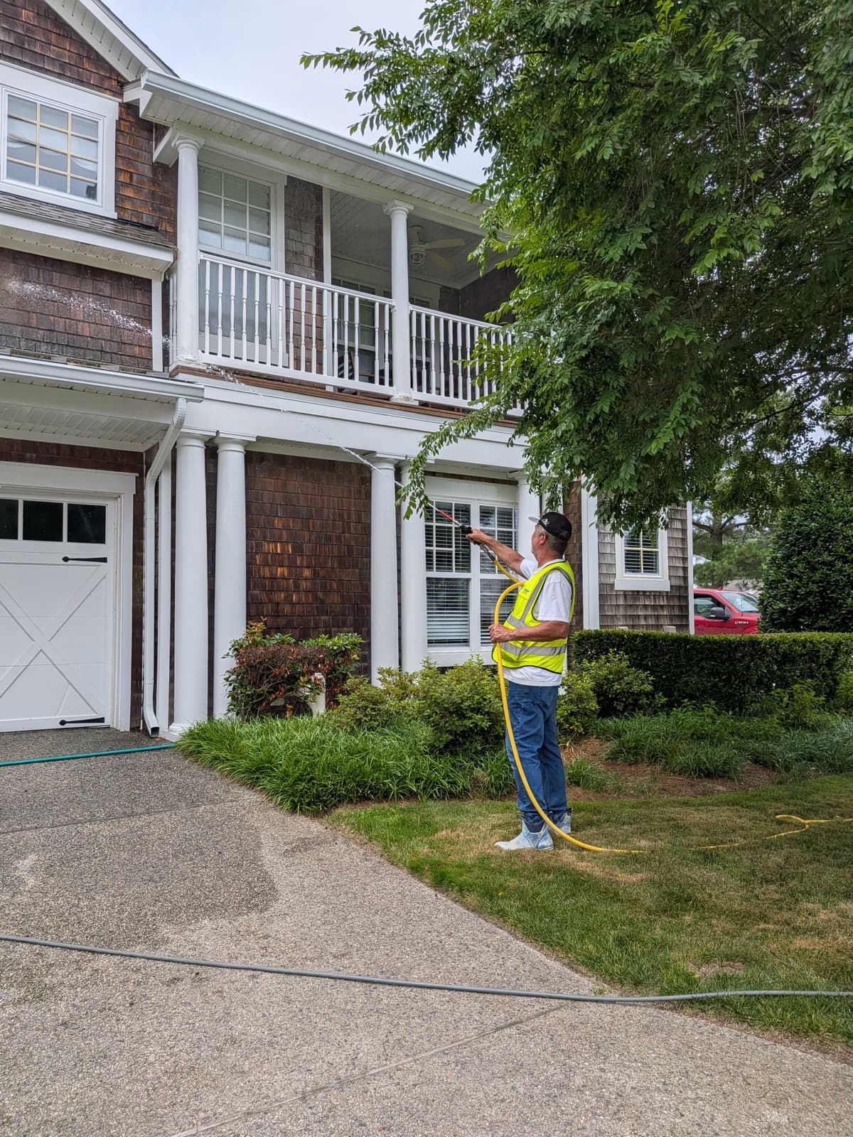 A freshly cleaned waterfront home with spotless upper-story windows
